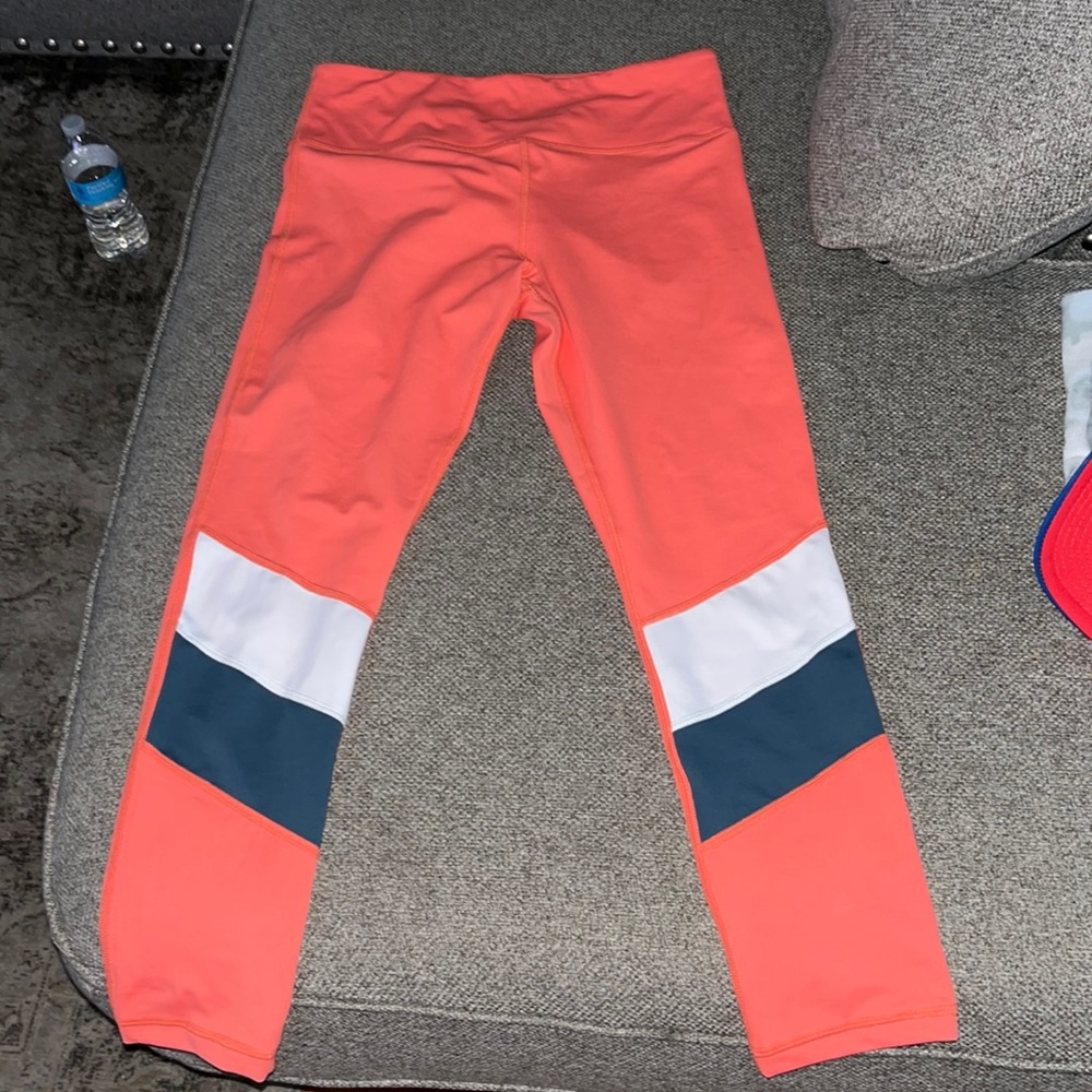 Zyia Tangerine with white and grey color block size 8-10 light and tight